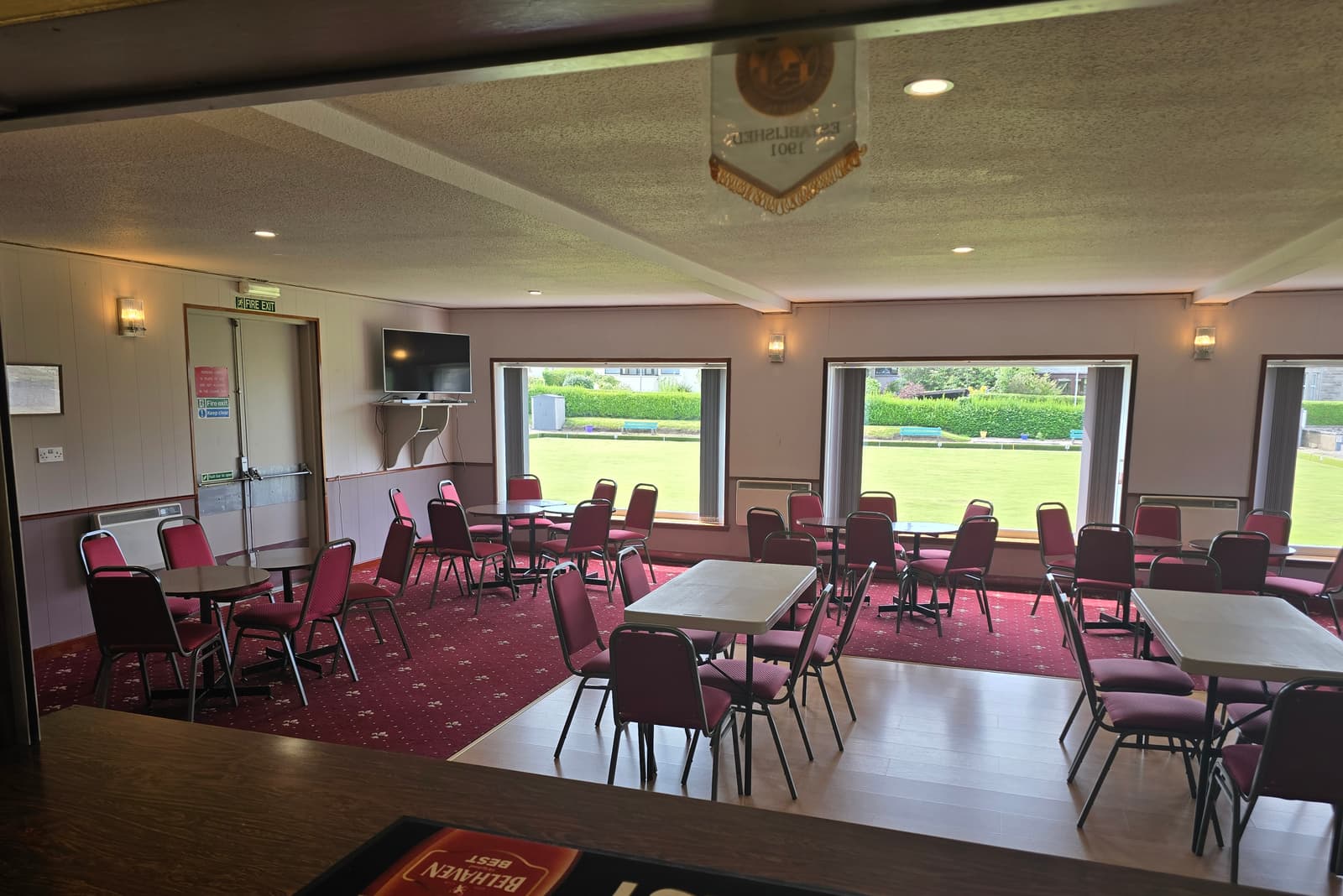 The lounge bar at Cullen Bowling Club, with picture windows overlooking the green
