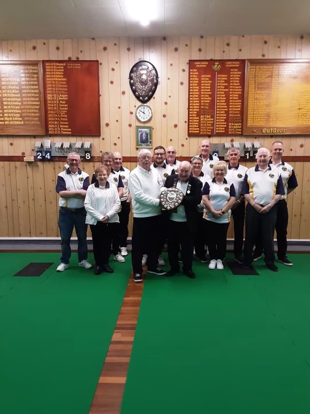 The club with a winter league shield on the indoor carpets